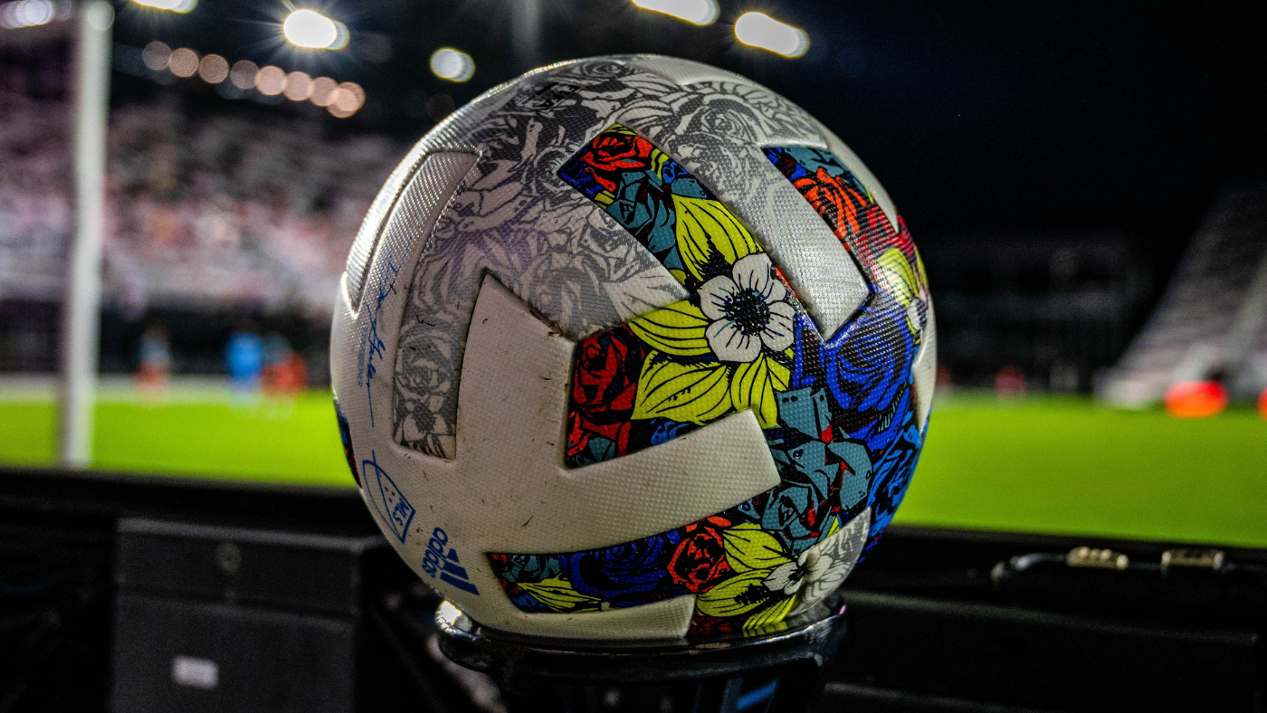 Soccer ball against an MLS stadium background