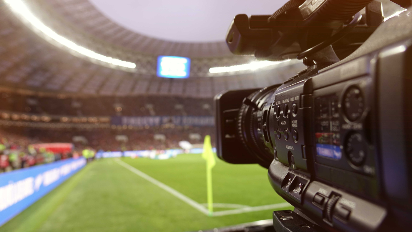Broadcasting camera filming a stadium