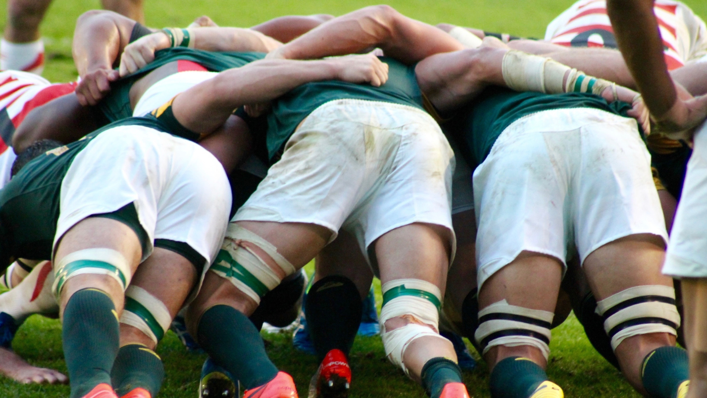 The South African rugby team in the middle of a scrum.