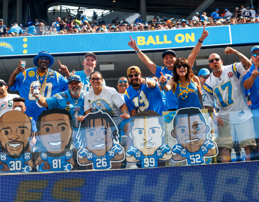 Crowd at sporting event shows fandom for different players
